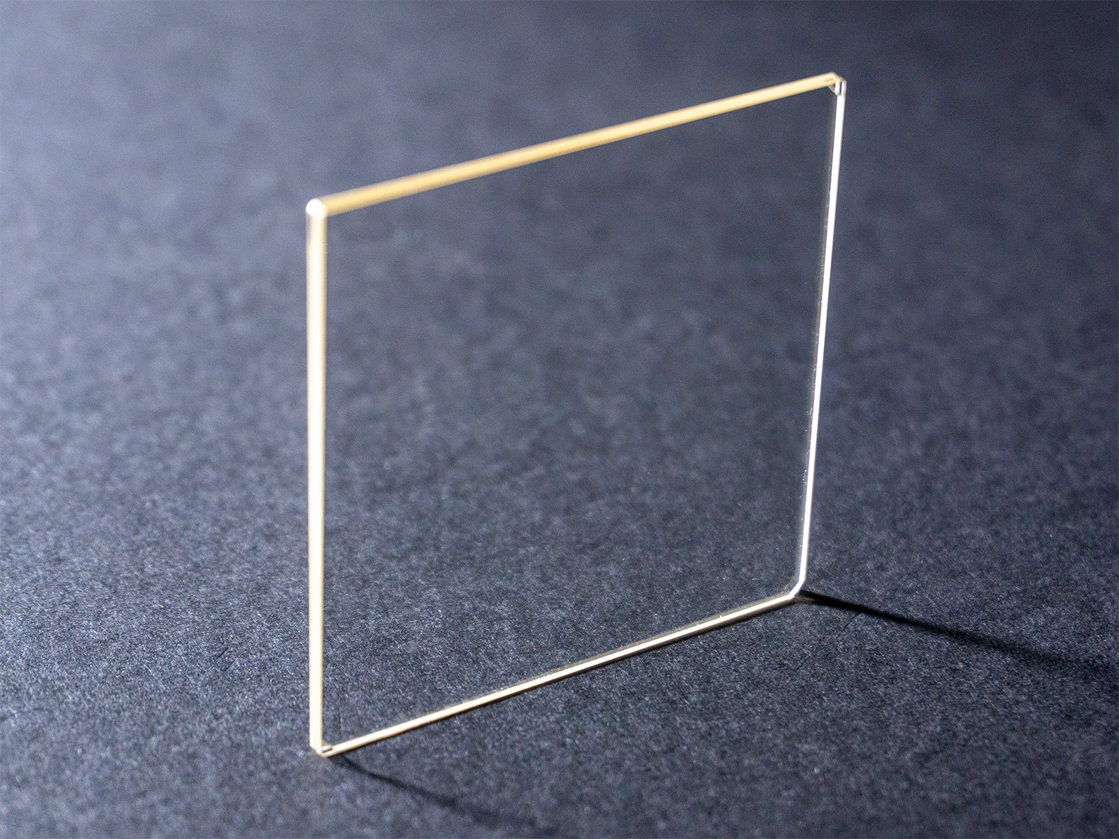 Lithium niobate optical filter on a dark laboratory background